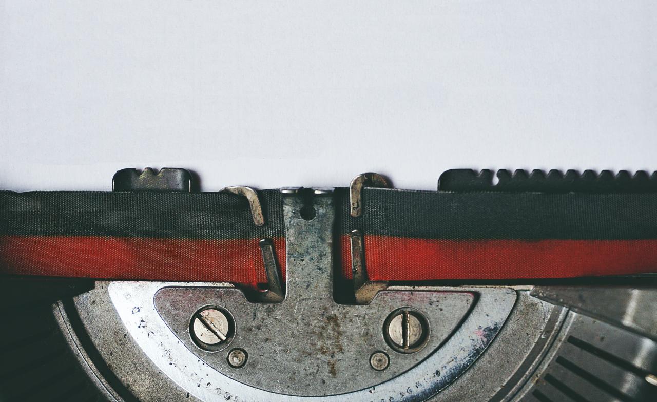 Typewriter ribbon and paper close up